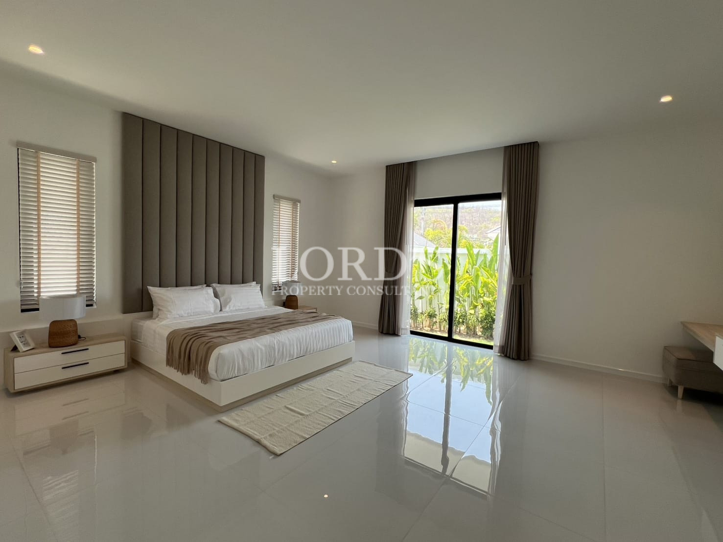 Spacious bedroom with large window view