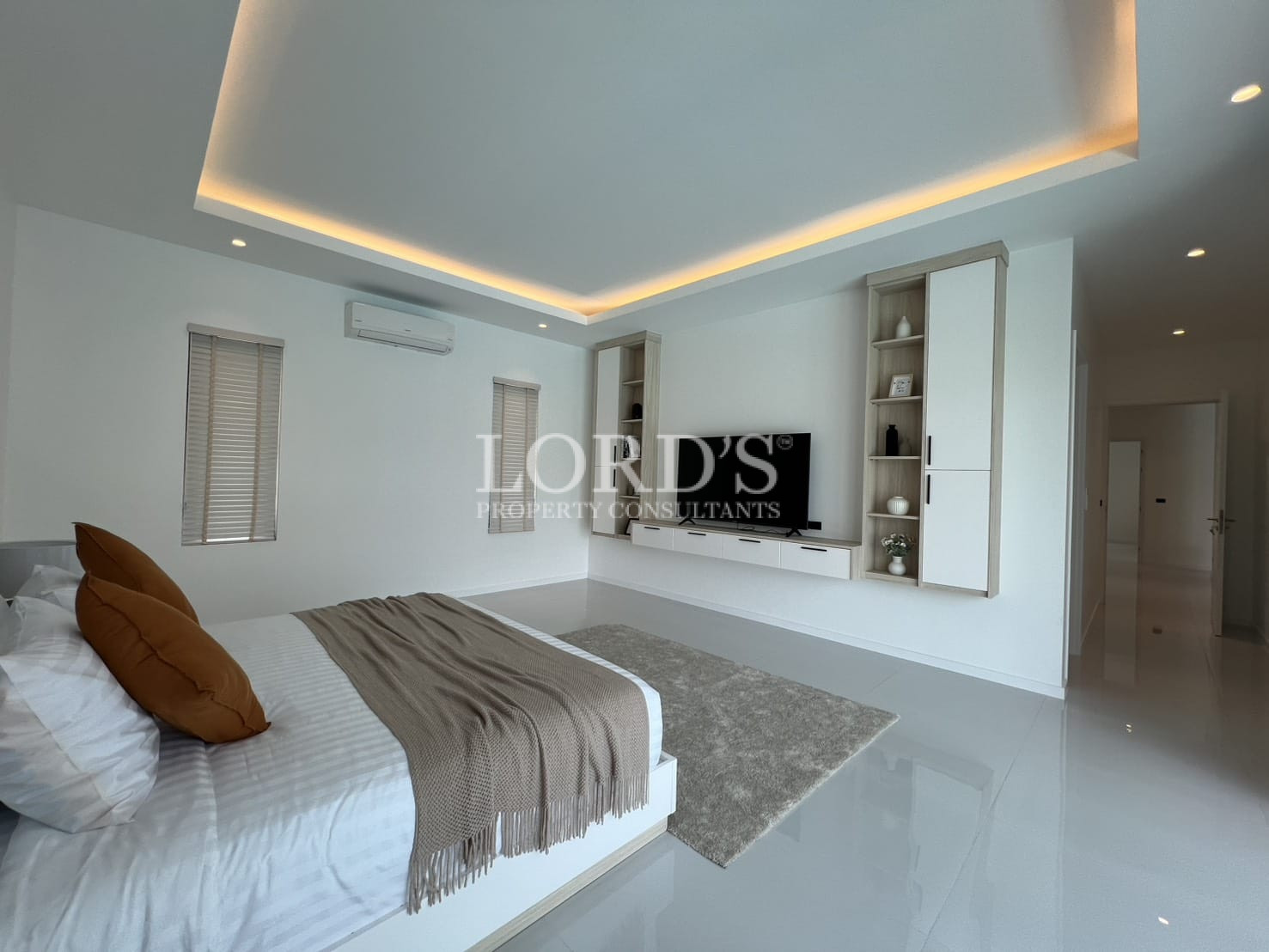 Bright bedroom with glossy floor and LED ceiling