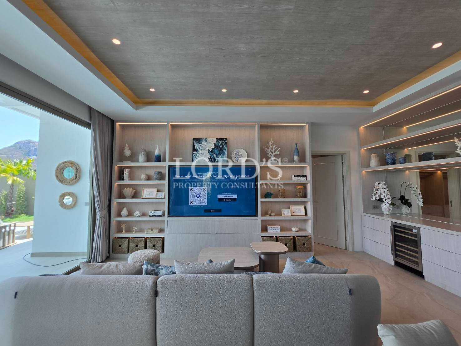 Living room with shelving and TV wall