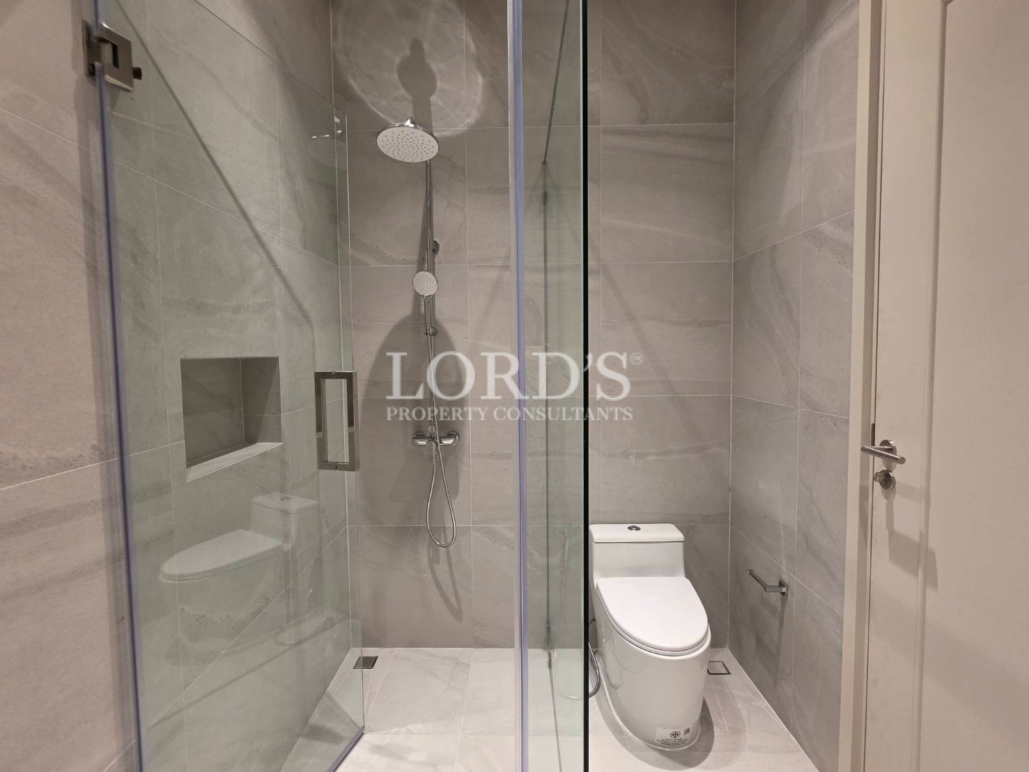 Bathroom with toilet and shower area