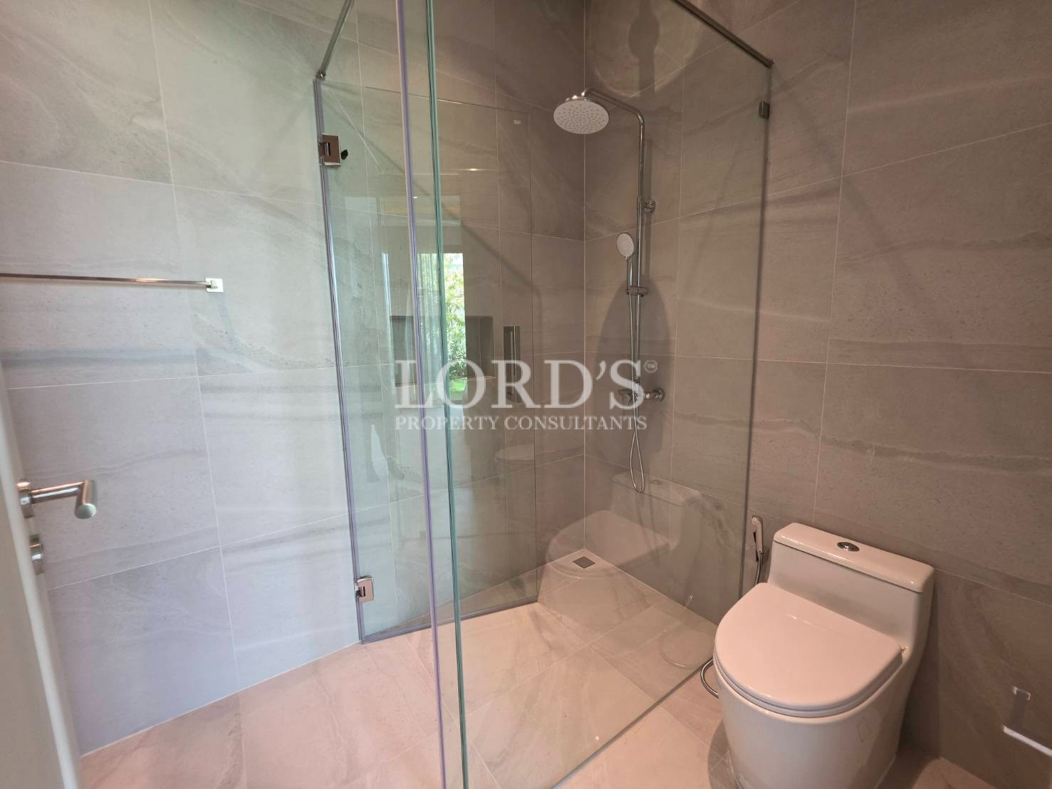 Bathroom with glass shower and toilet