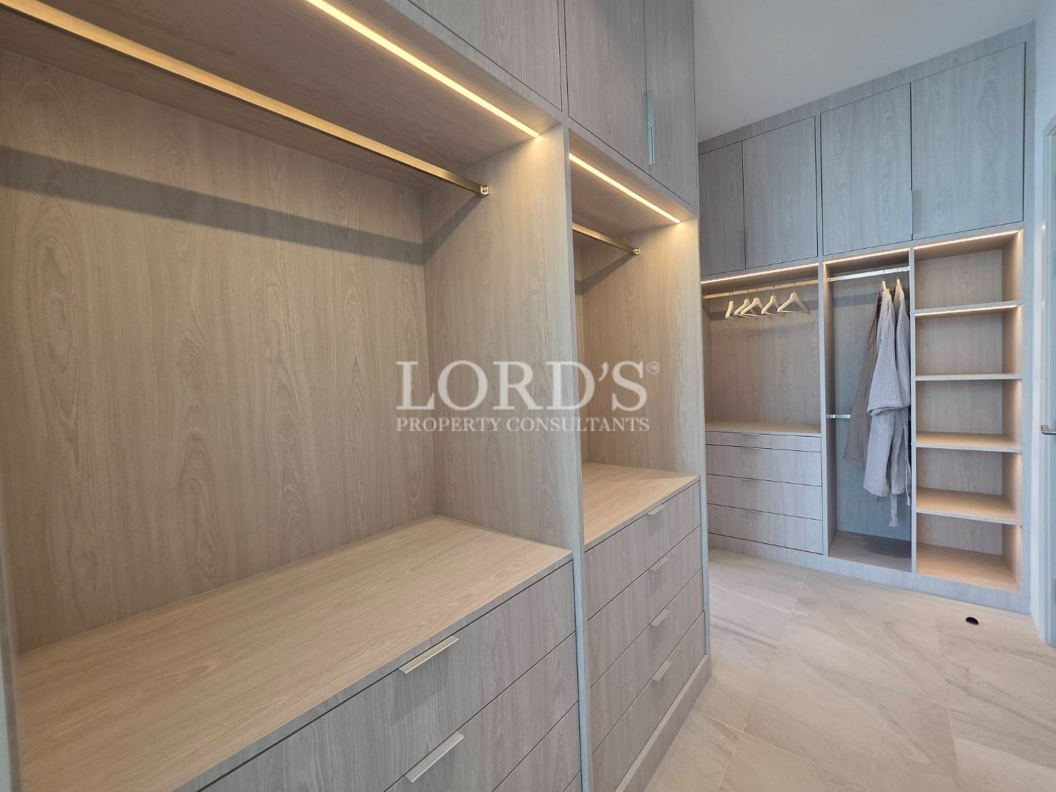 Bathroom with bathtub and built-in shelving