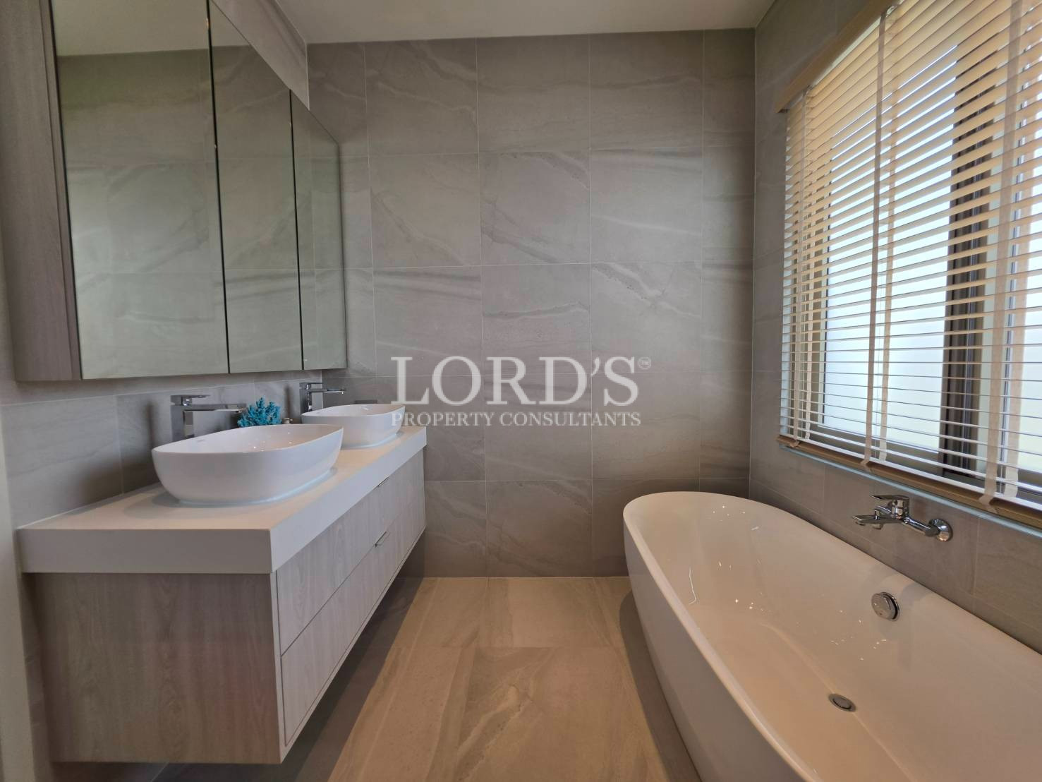 Bathroom with bathtub and vanity