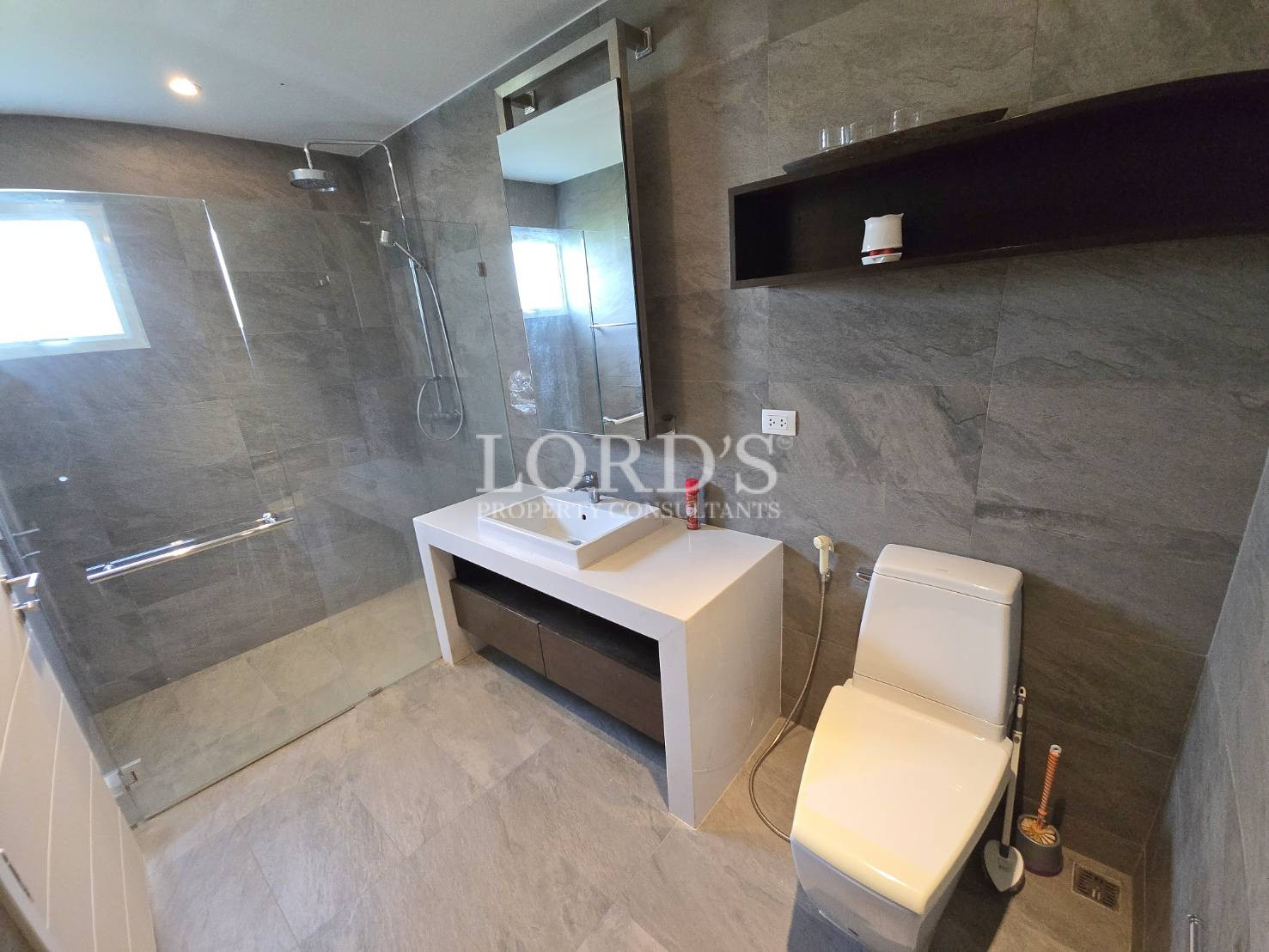 Bathroom with bathtub and seating