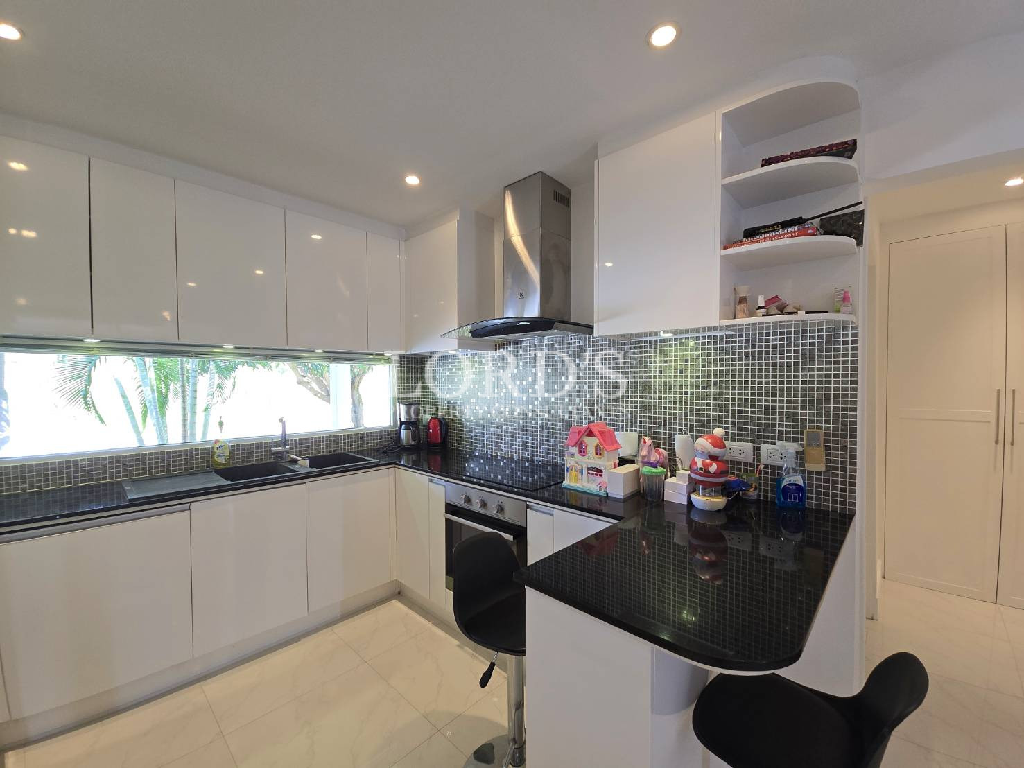 Kitchen with black countertop and cabinets