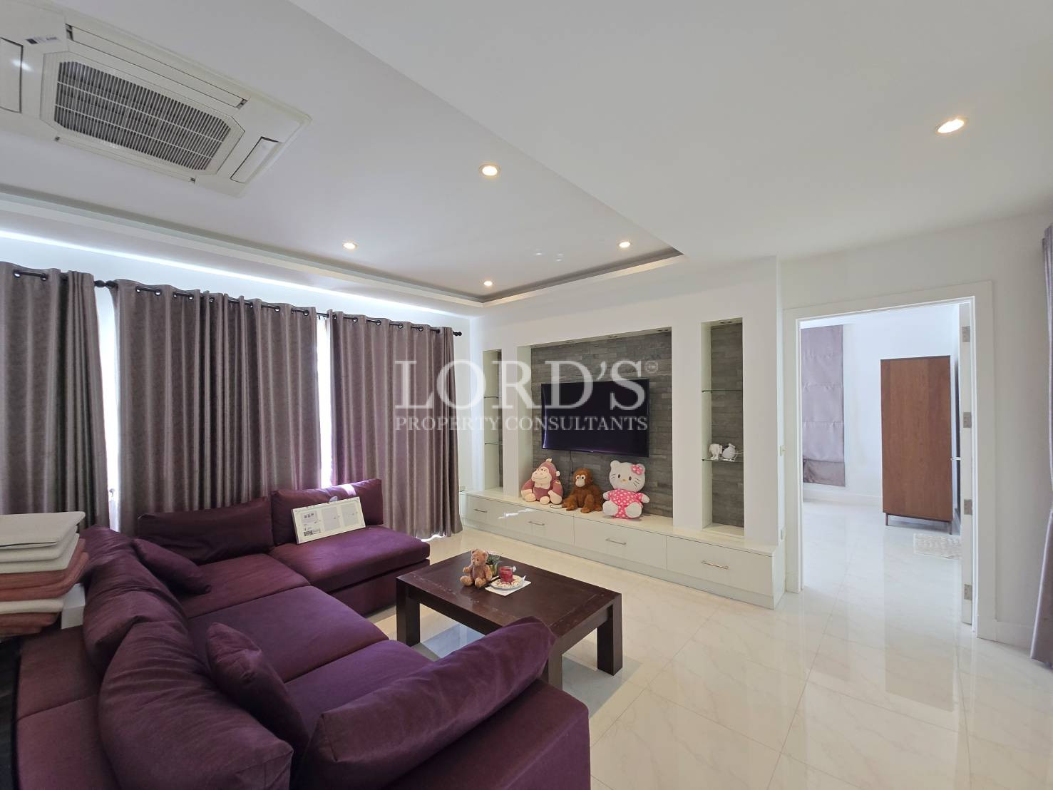 Living room with purple sofa set
