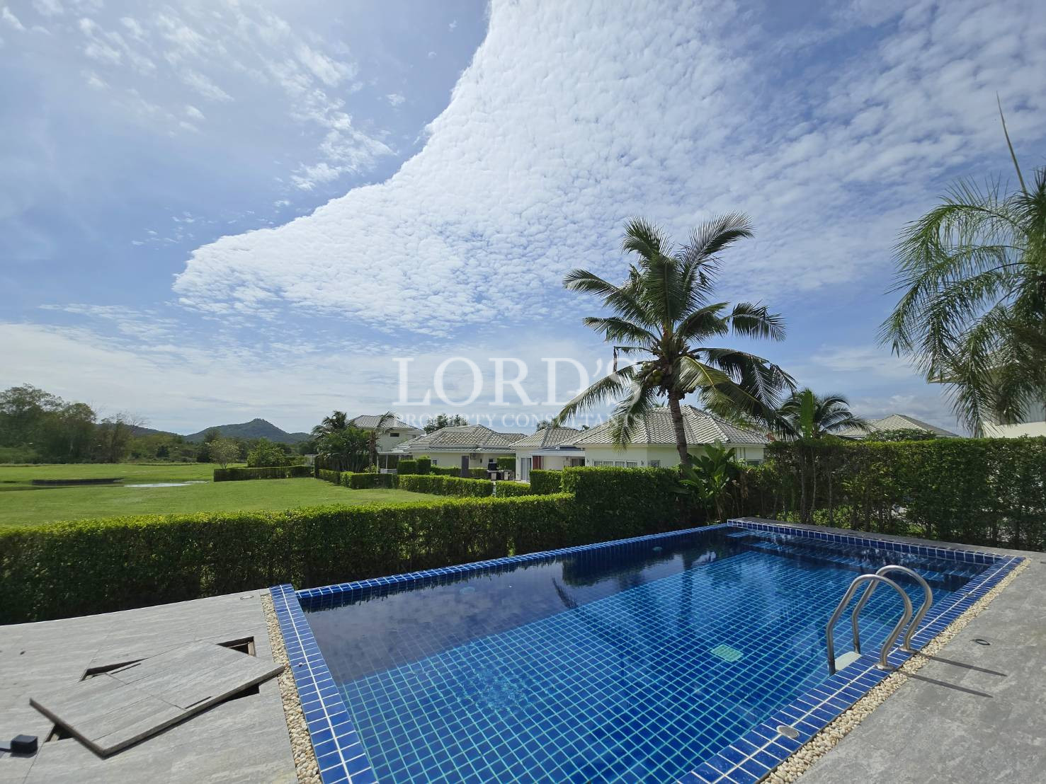 Infinity pool with mountain and sky view
