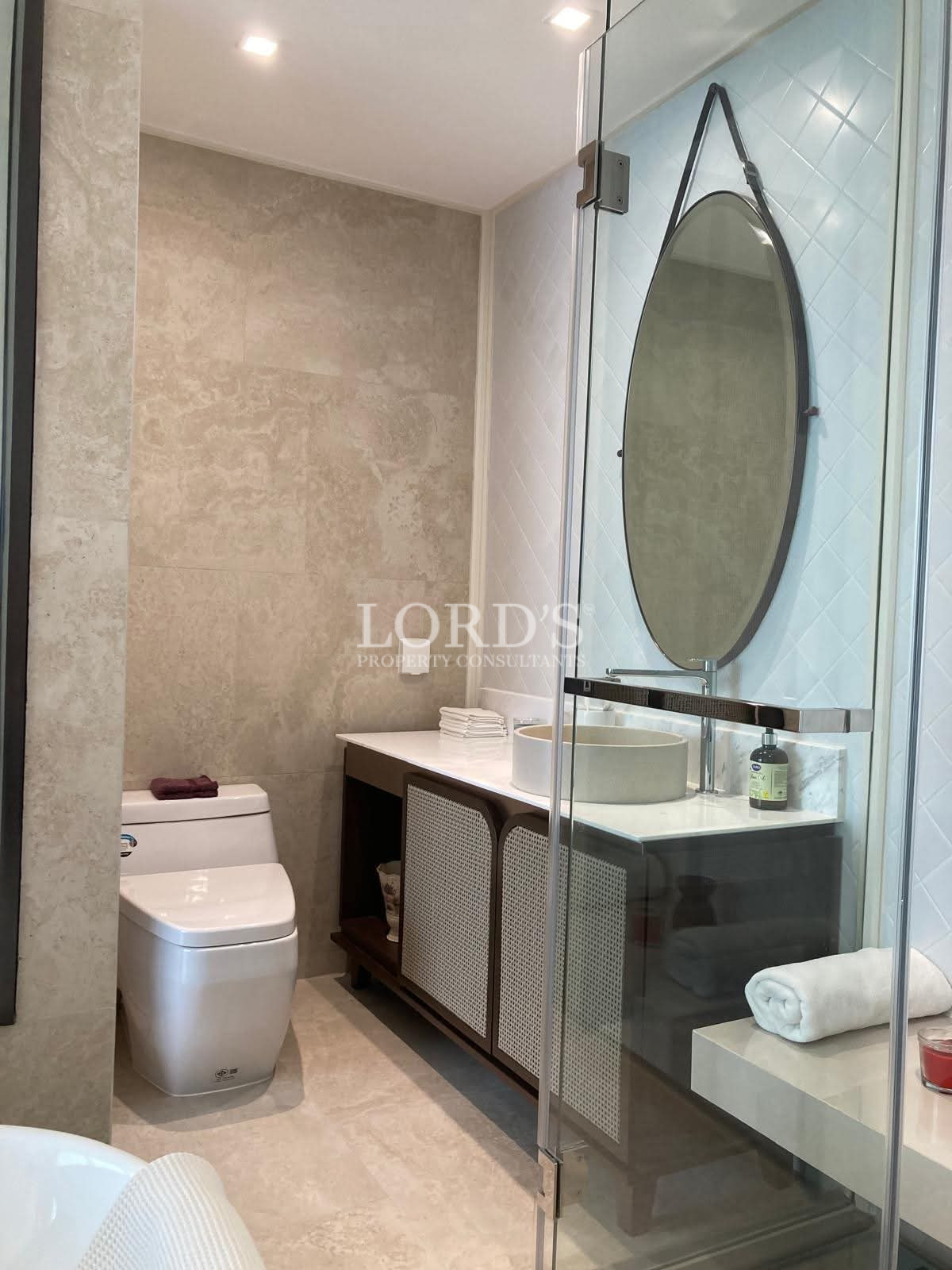 Bathroom with glass shower and vanity