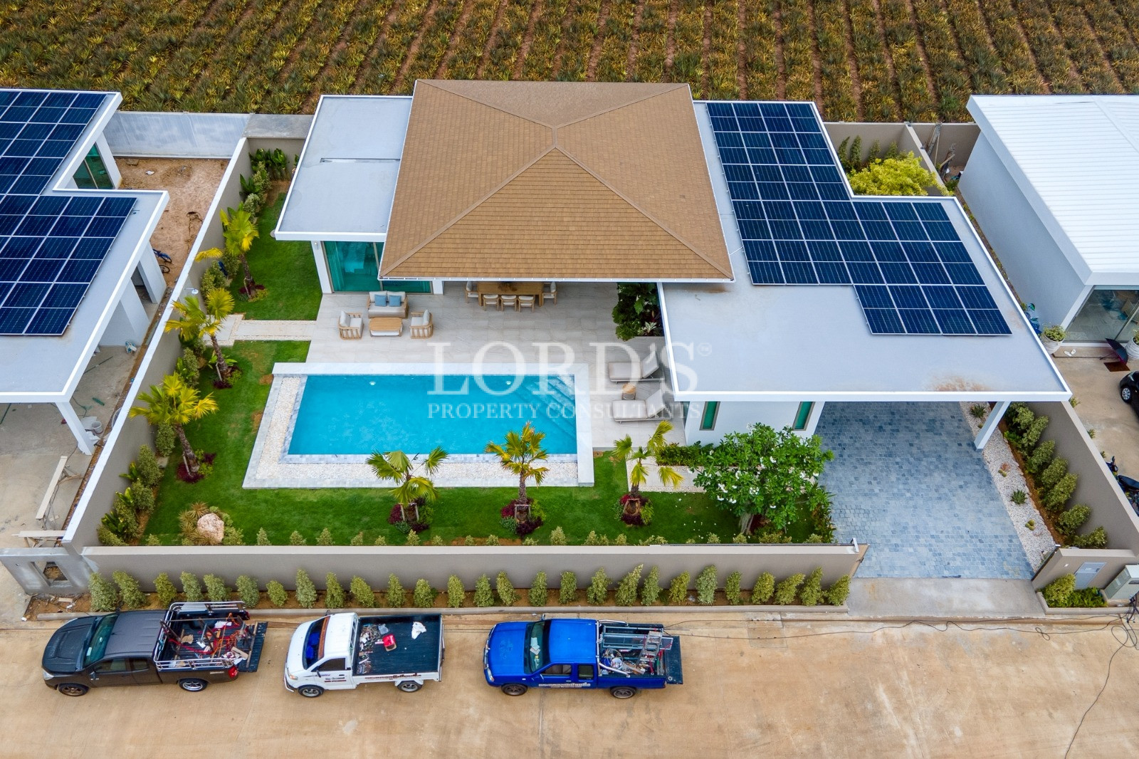 Drone view of villa with solar panels