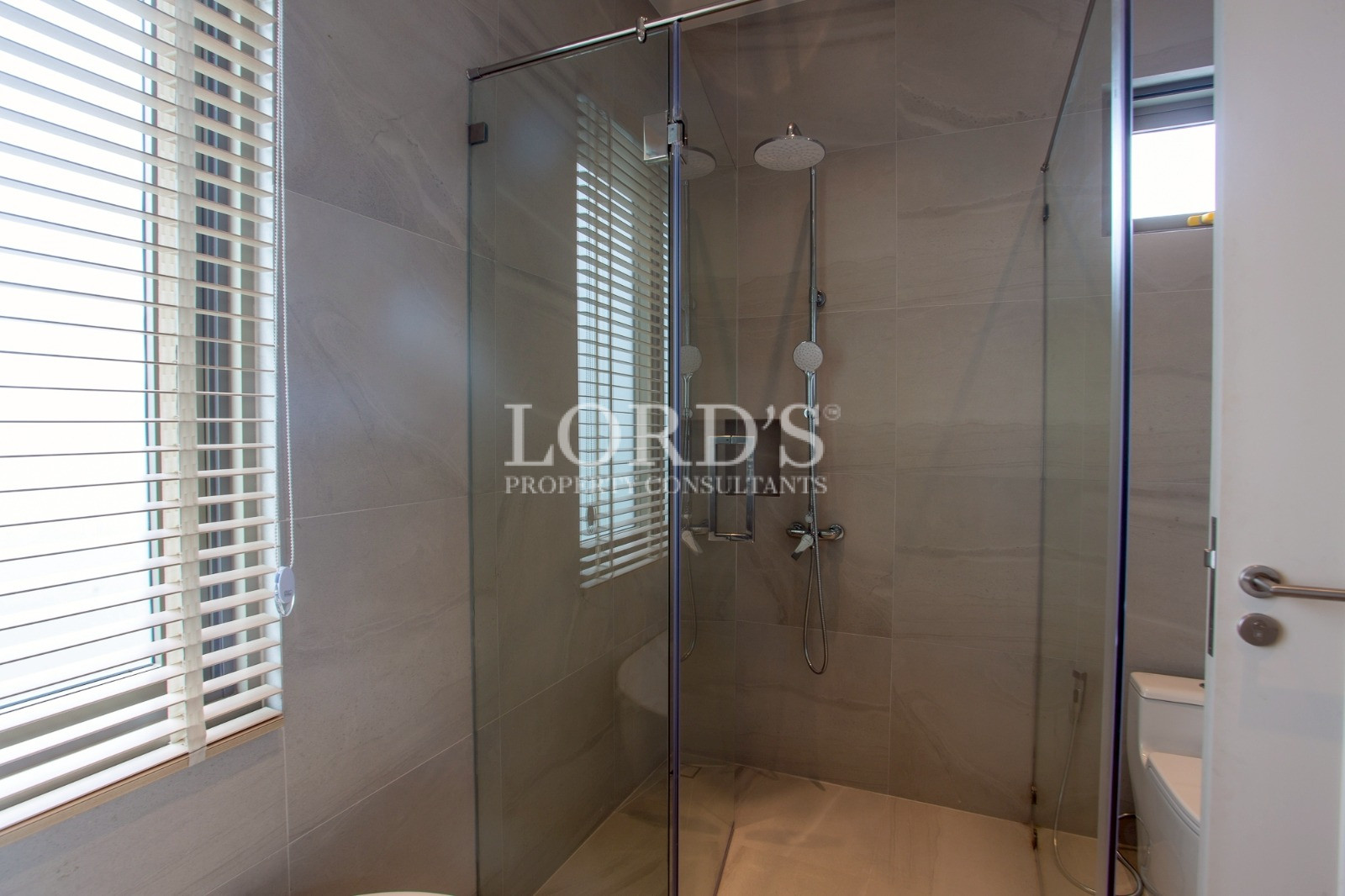Glass shower enclosure in luxury bathroom