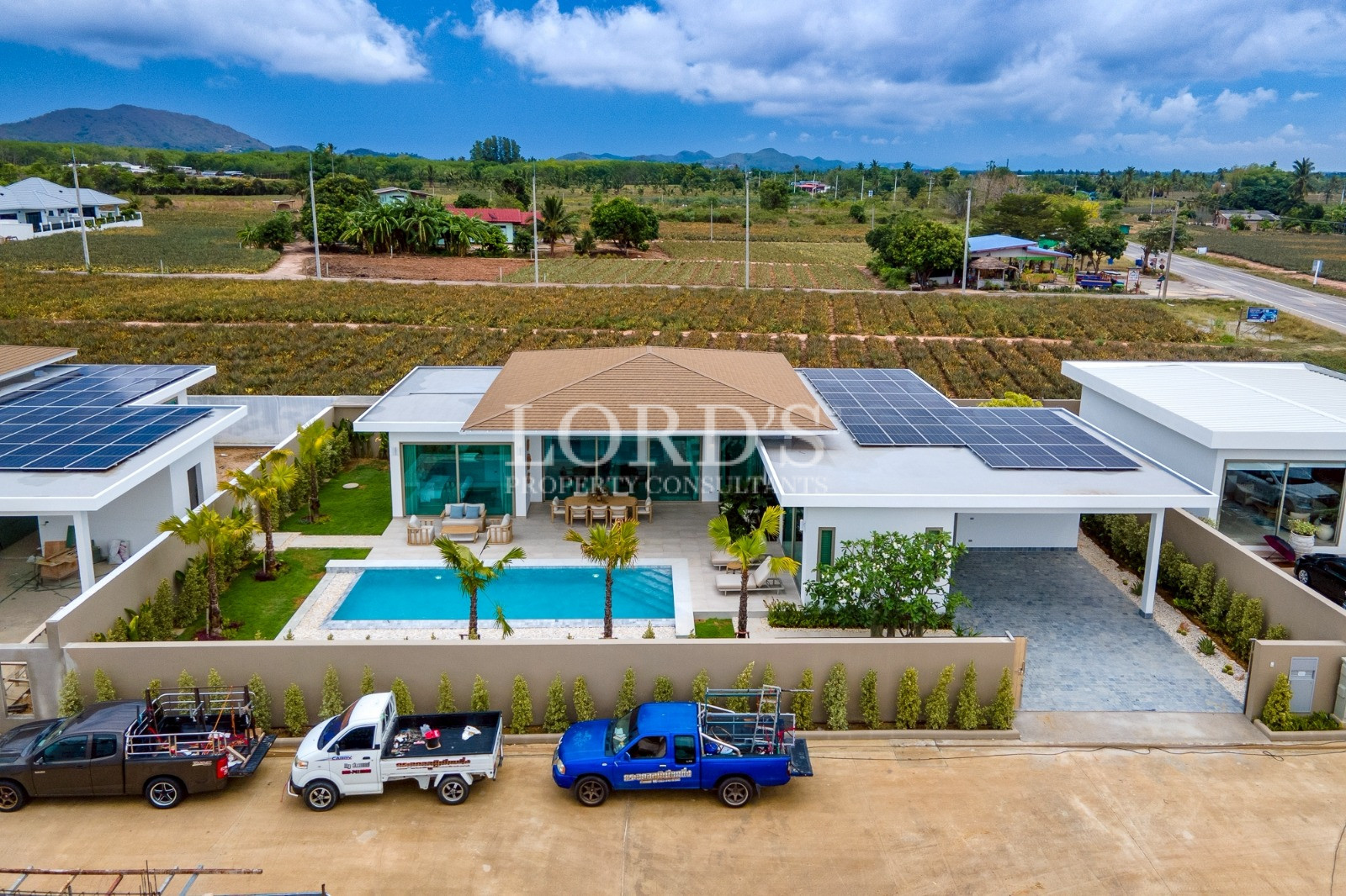 Aerial view of villa and parking area
