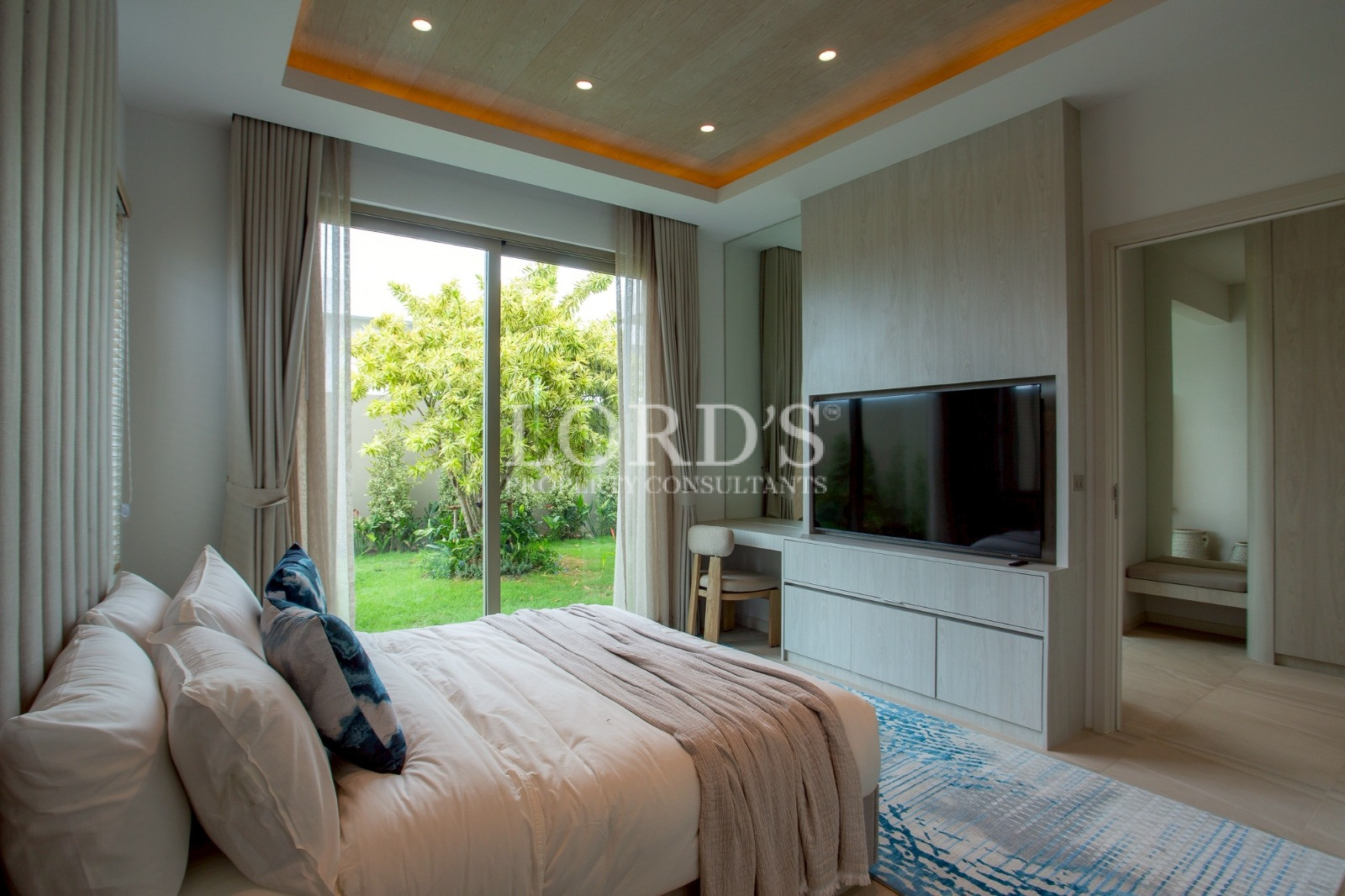 Bedroom with TV and garden view