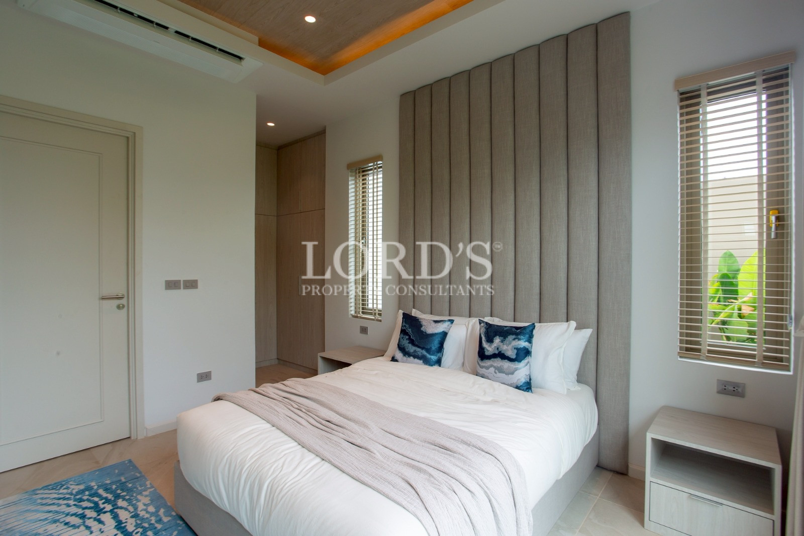 Contemporary bedroom with wood panel walls