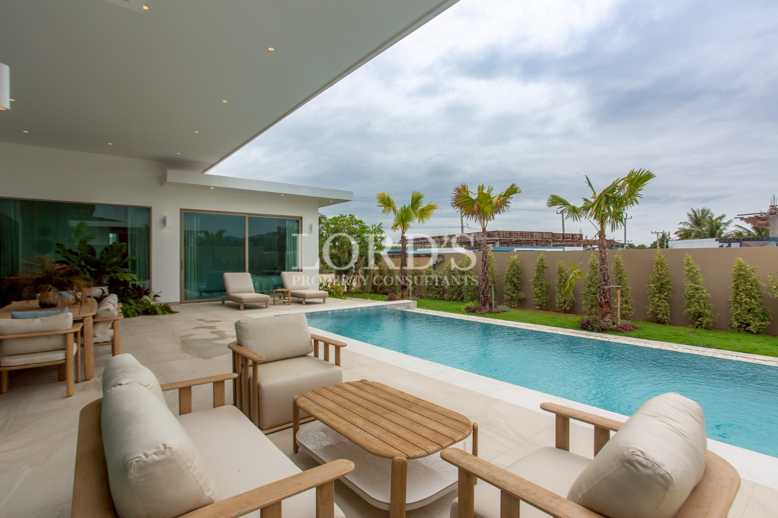 Poolside patio with outdoor furniture