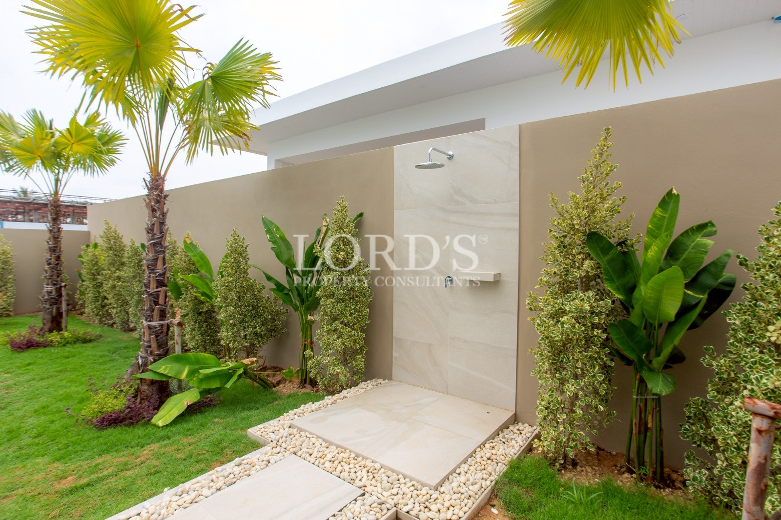 Covered outdoor patio with greenery