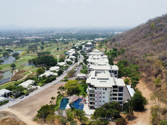 Aerial view of buildings near hillside