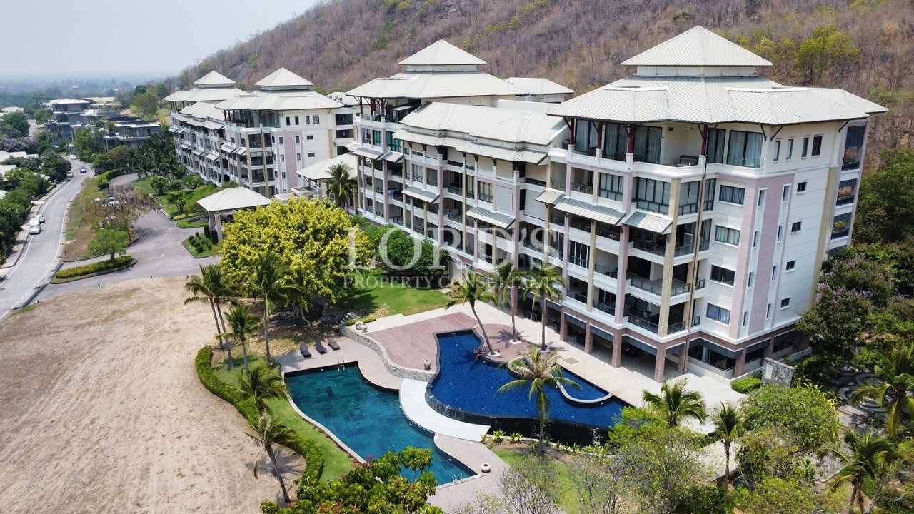 Aerial view of apartment with pool