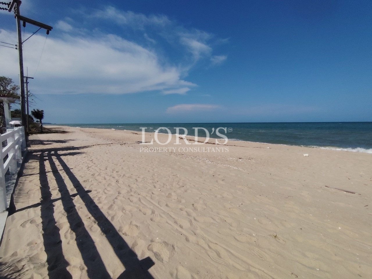Wide sandy beach with ocean horizon
