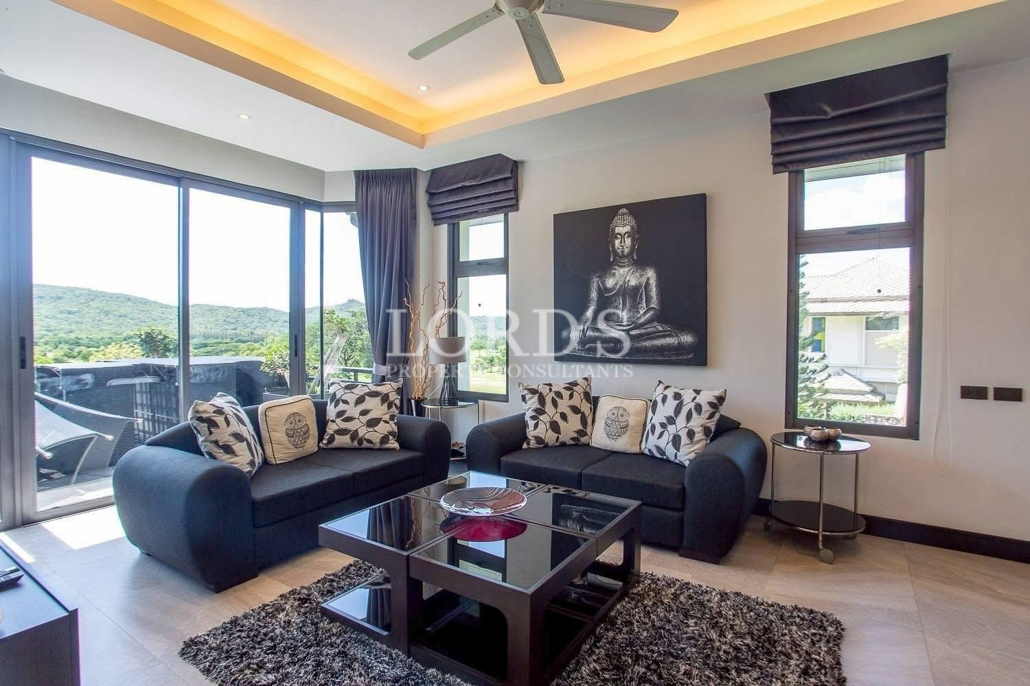 Living room with large windows and mountain view