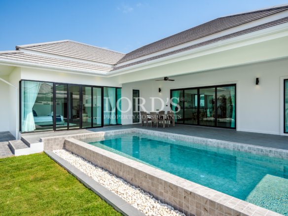 Modern villa with swimming pool and glass doors