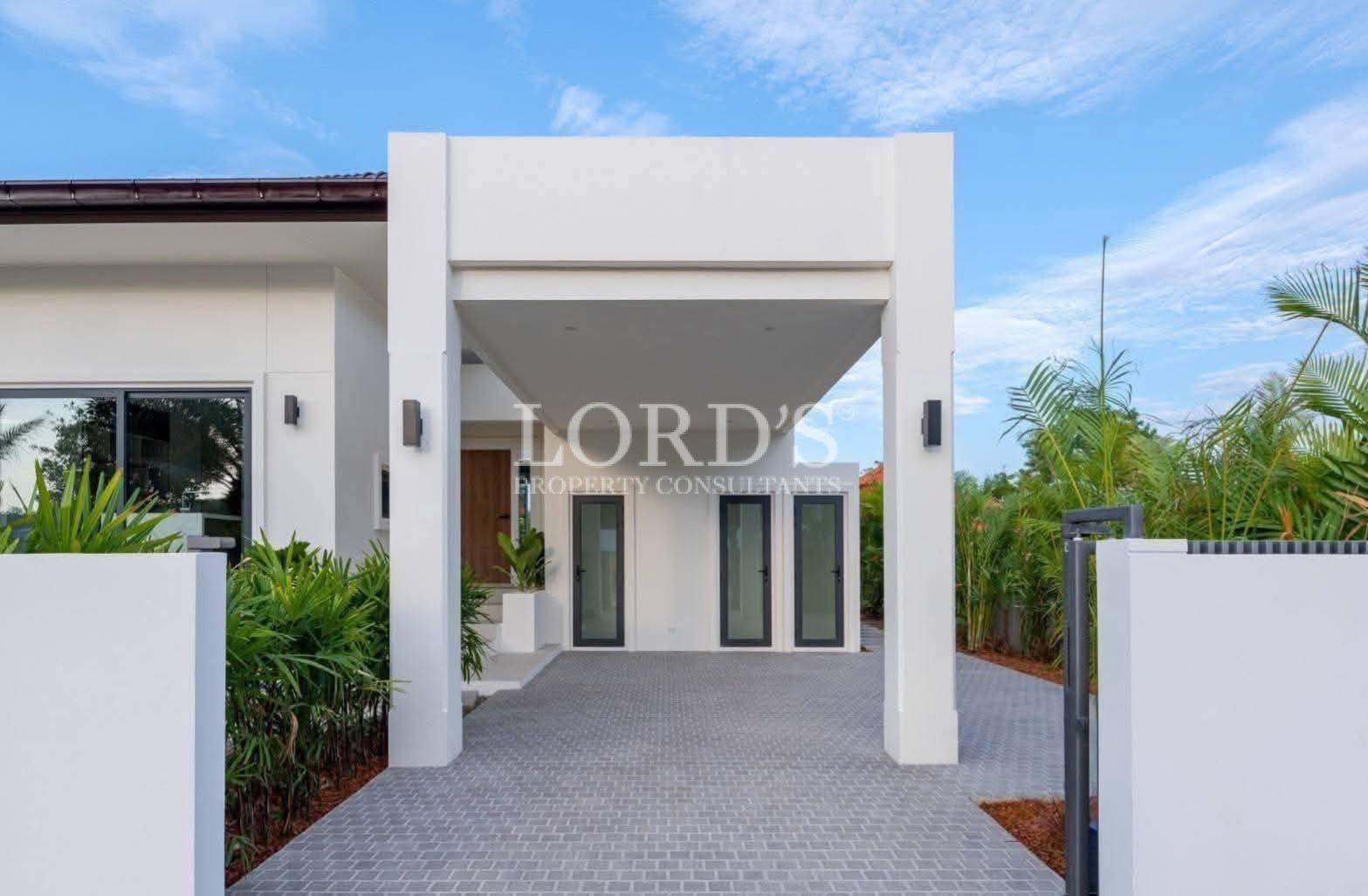 Modern villa entrance with open doorway