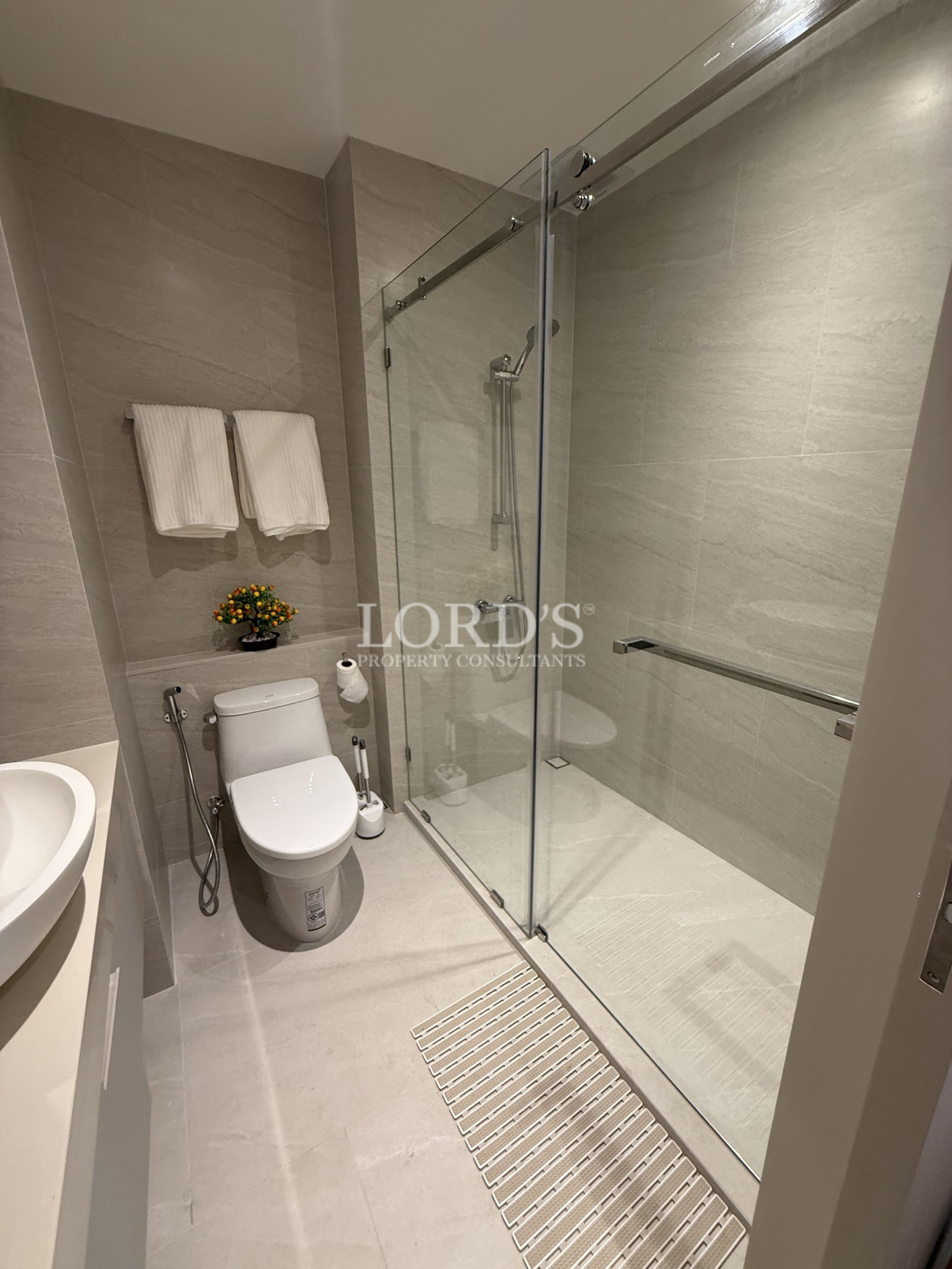 Modern bathroom with toilet and glass shower