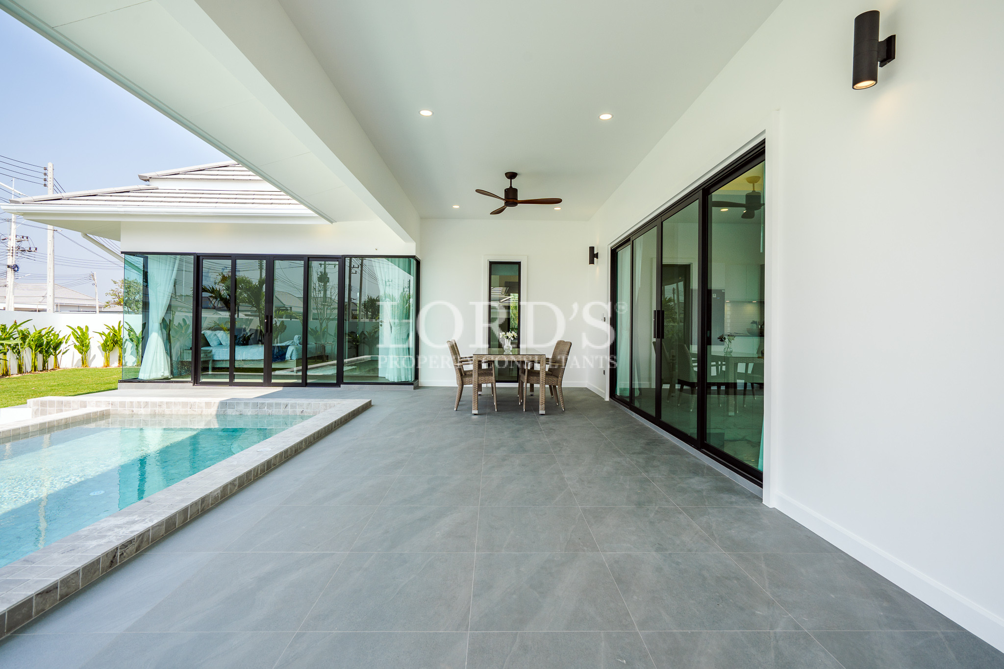 Spacious terrace with pool and dining area
