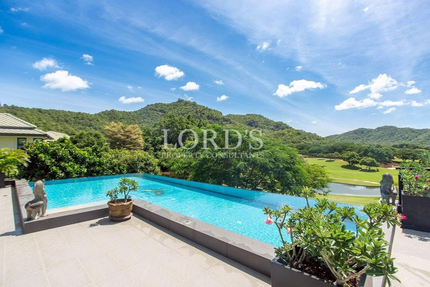 Infinity pool overlooking mountains and greenery