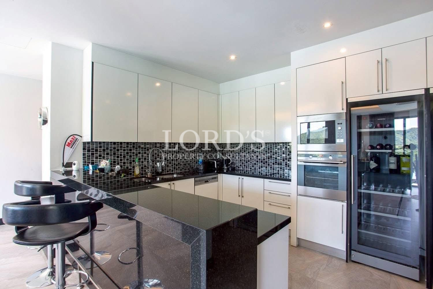 Modern kitchen with island and glossy cabinets