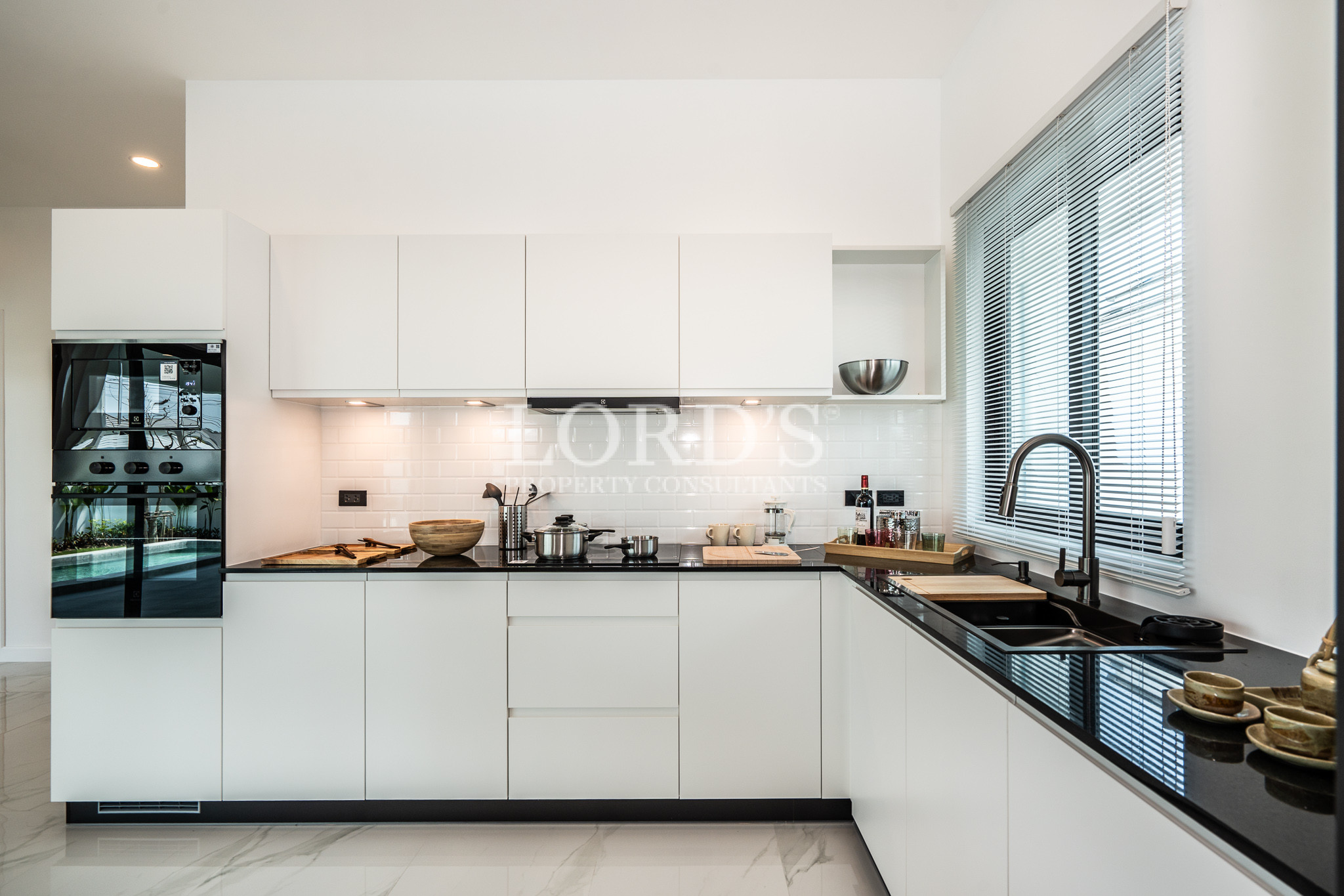 Modern white kitchen with sleek cabinetry