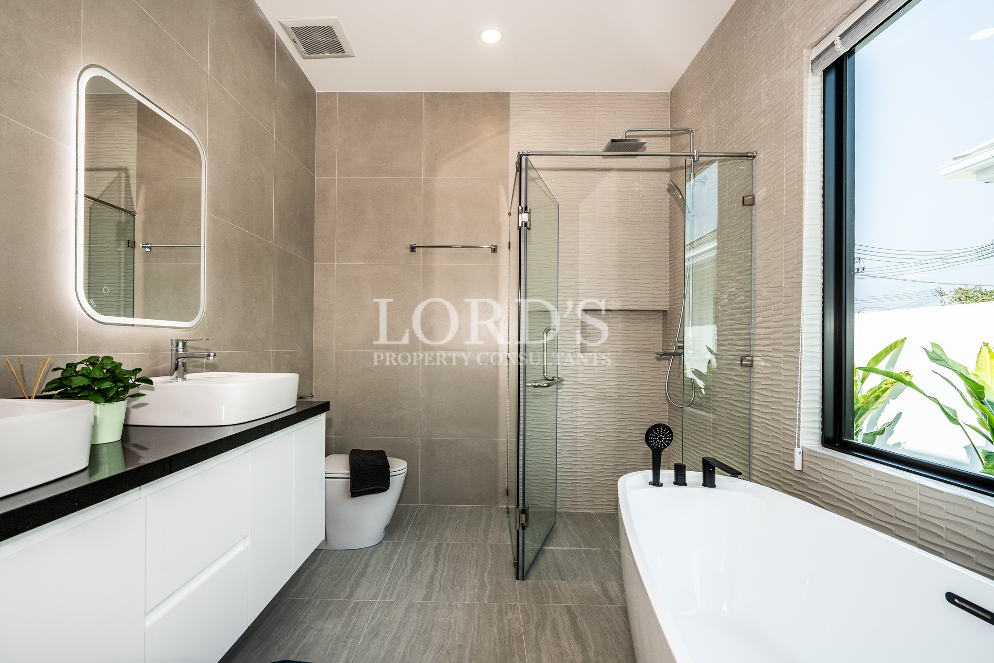 Modern bathroom with glass shower and vanity