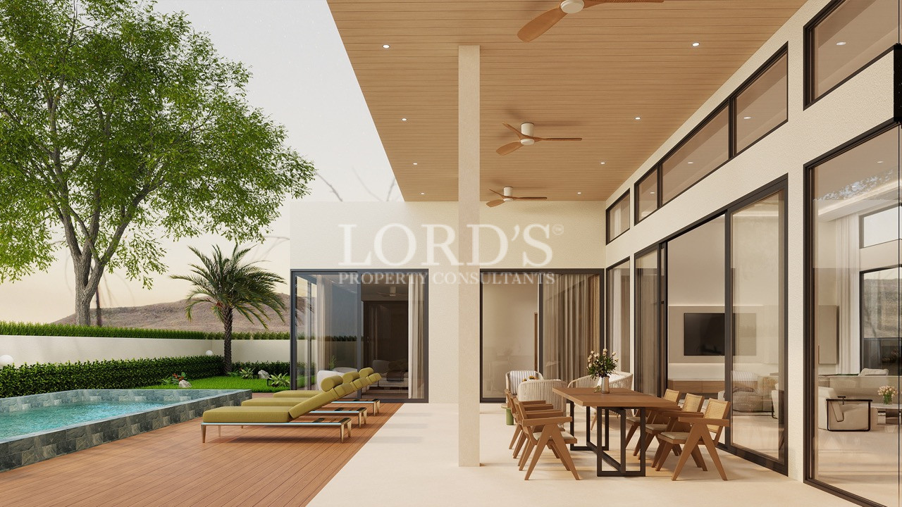 Covered outdoor terrace with seating area