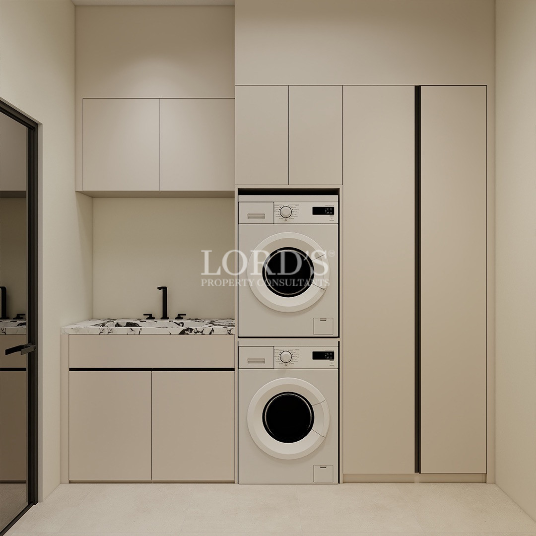 Minimalist laundry room with built-in appliances