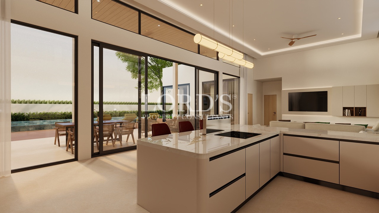 Spacious villa lounge with panoramic glass walls