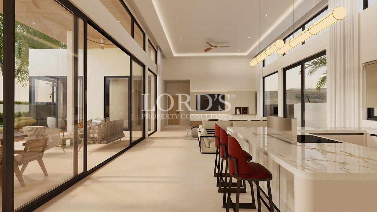 Open-plan luxury villa interior with large windows