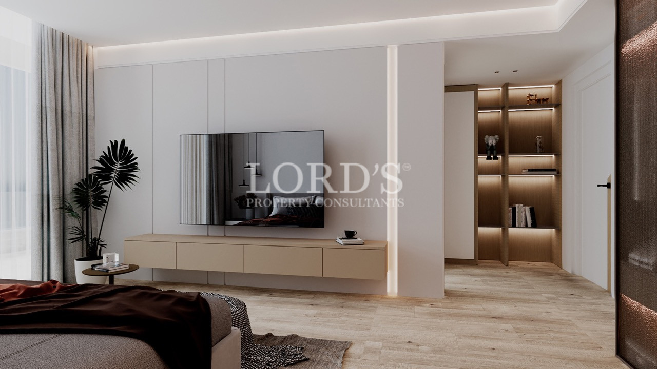 Minimalist bedroom with TV wall and warm lighting
