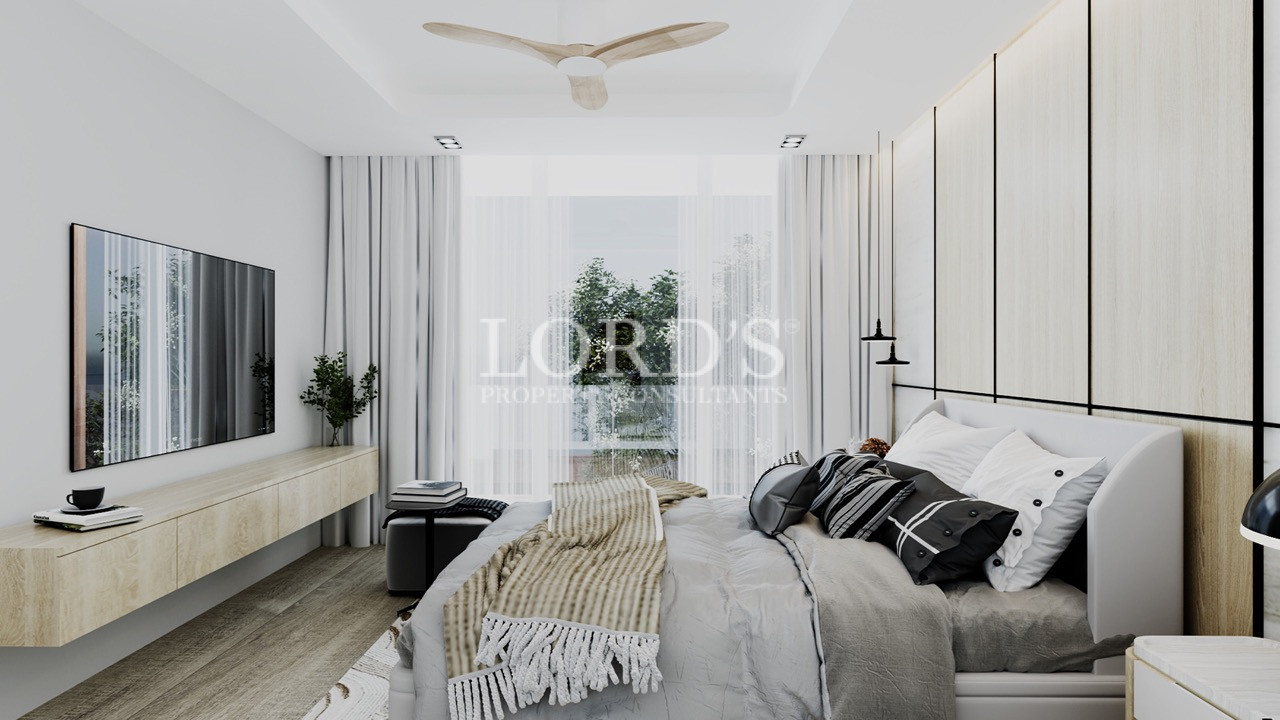 Bright bedroom with soft curtains and ceiling fan