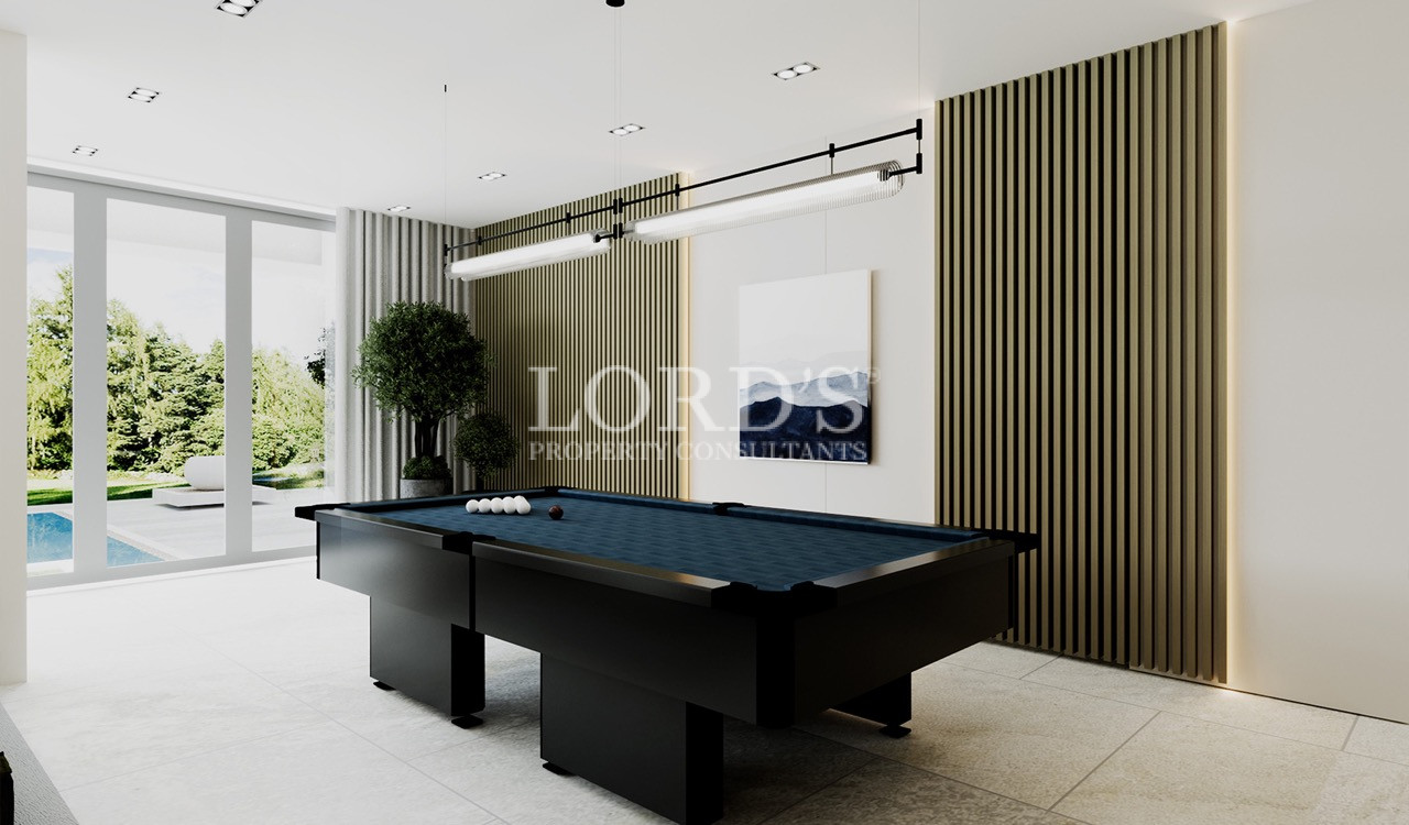 Modern billiards room with pool table and floor-to-ceiling windows