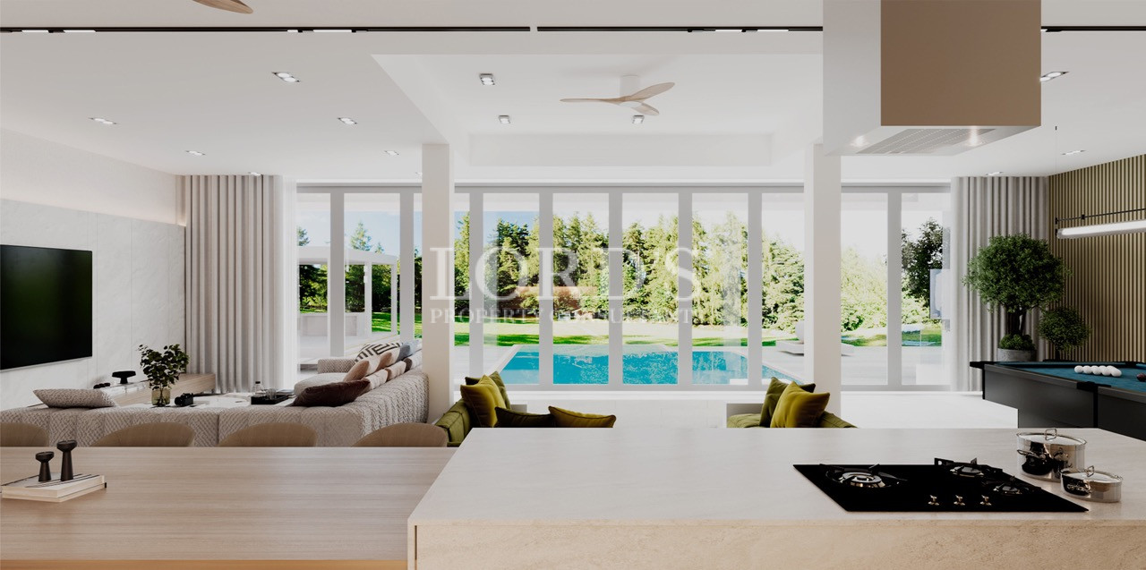 Open-plan living room with poolside view