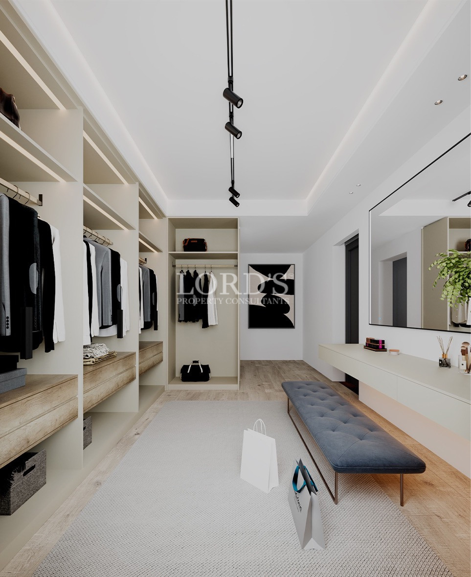 Spacious wardrobe area with modern shelving design