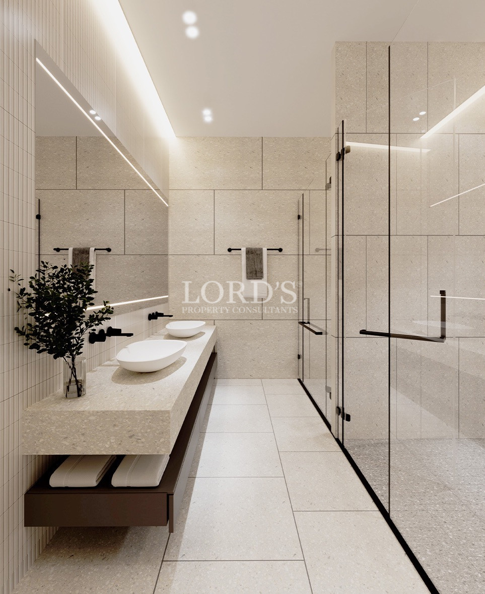 Modern bathroom with freestanding tub and glass walls