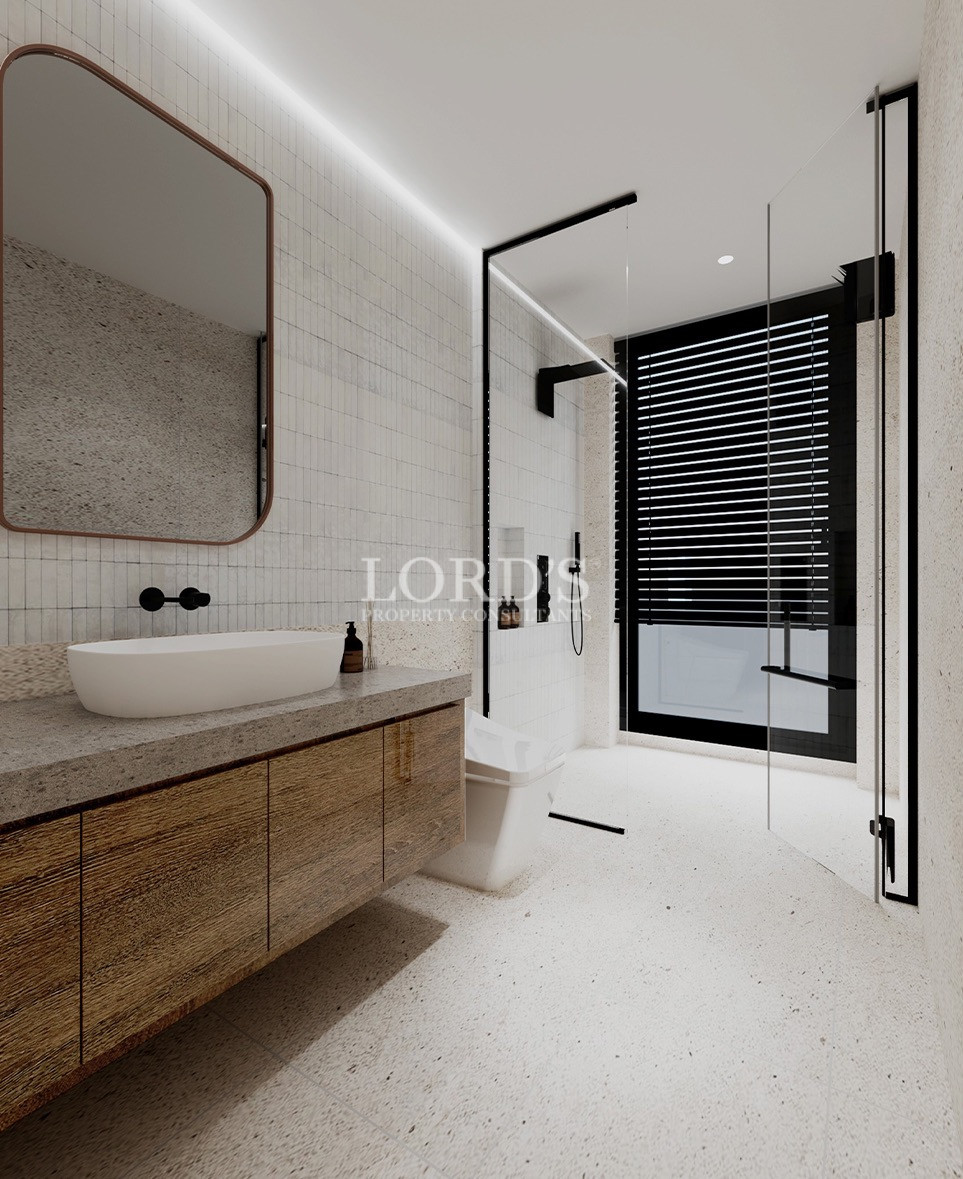 Minimalist bathroom vanity with round mirror