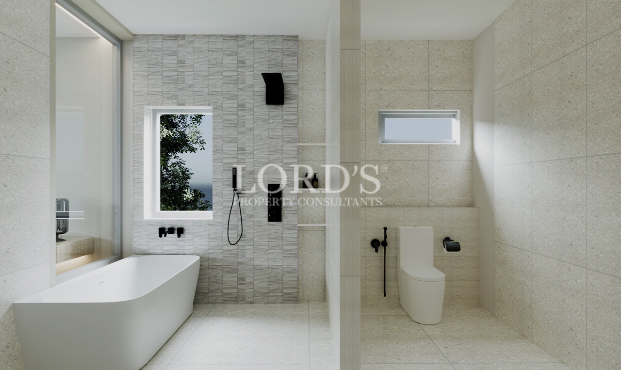 Modern bathroom with rainfall shower and stone walls