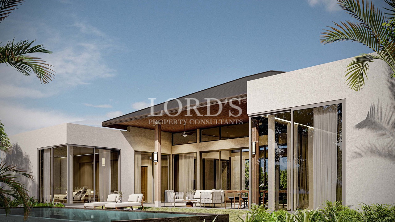 Luxury villa with poolside loungers and open architecture