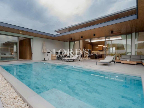 Luxury villa pool with covered outdoor lounge