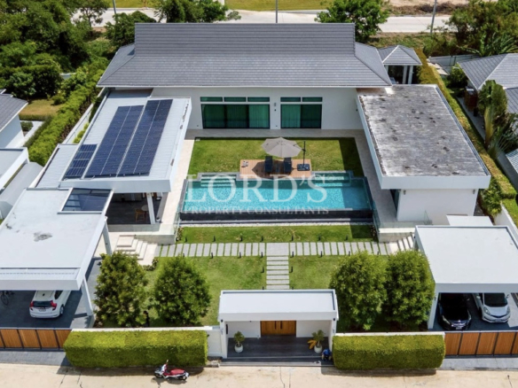 Drone view of modern villa with solar roof