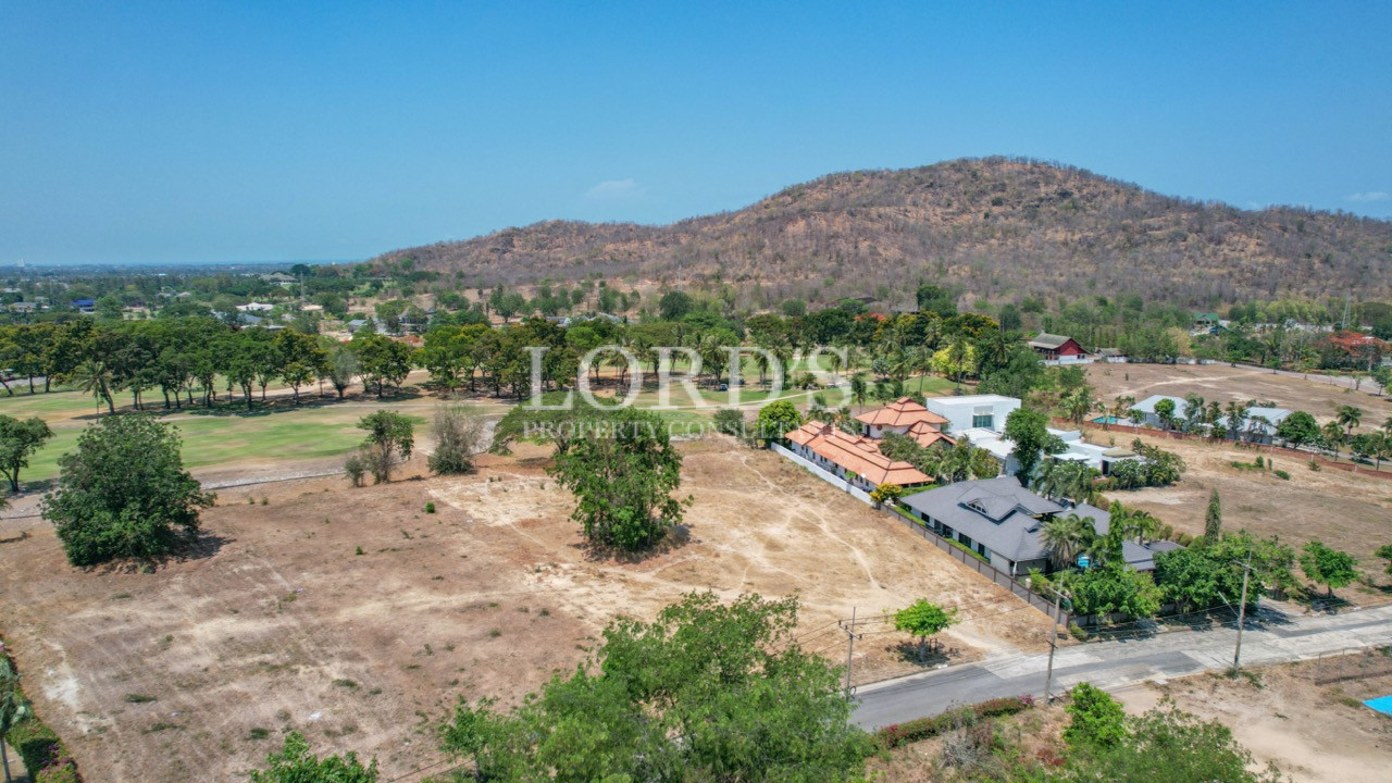Aerial view of vacant land near homes