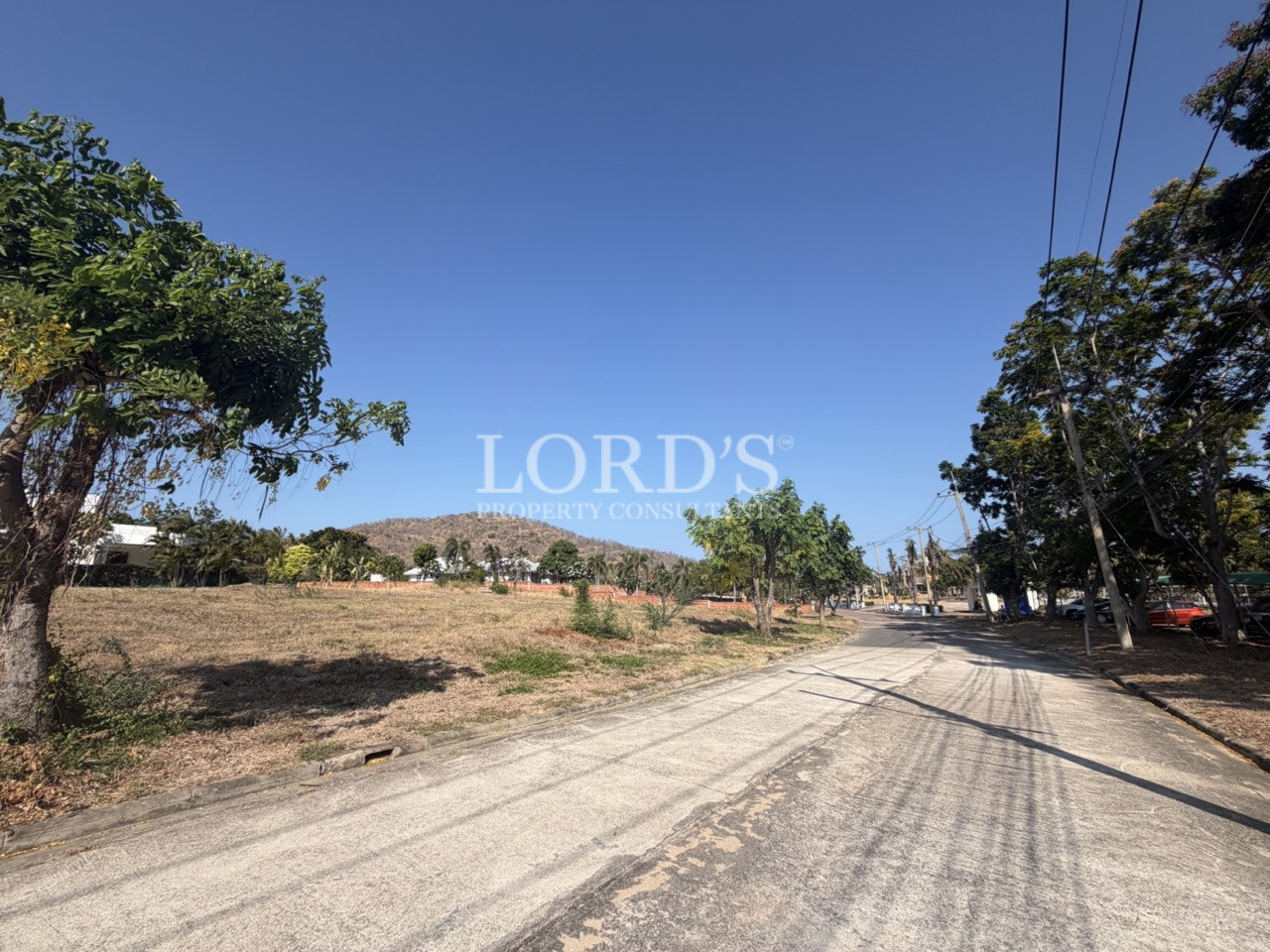Gravel road passing vacant land