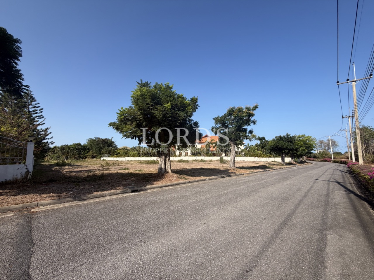Rural road beside land plot