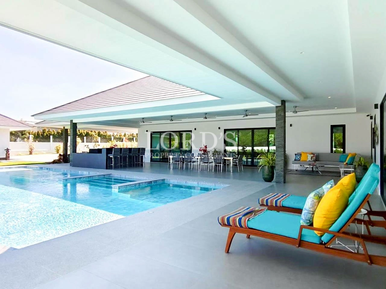 Covered outdoor pool lounge with modern architecture
